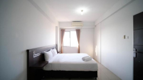 Simple 2BR with Extra Bed at Menara Rungkut Apartment By Travelio